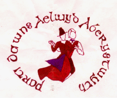 Parti Dawns Aelwyd Aberystwyth Logo - Designed by Delyth Thomas 1996. Design represents the shape of the map of Wales, with the lady's fedog (apron) covering the area of the county of Ceredigion, where Aberystwyth is the principal town.